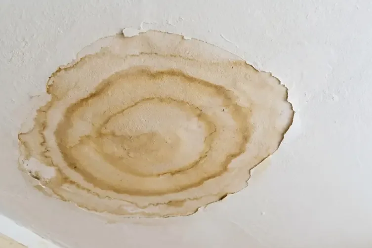 A ceiling stained by overflow from an air conditioner drain
