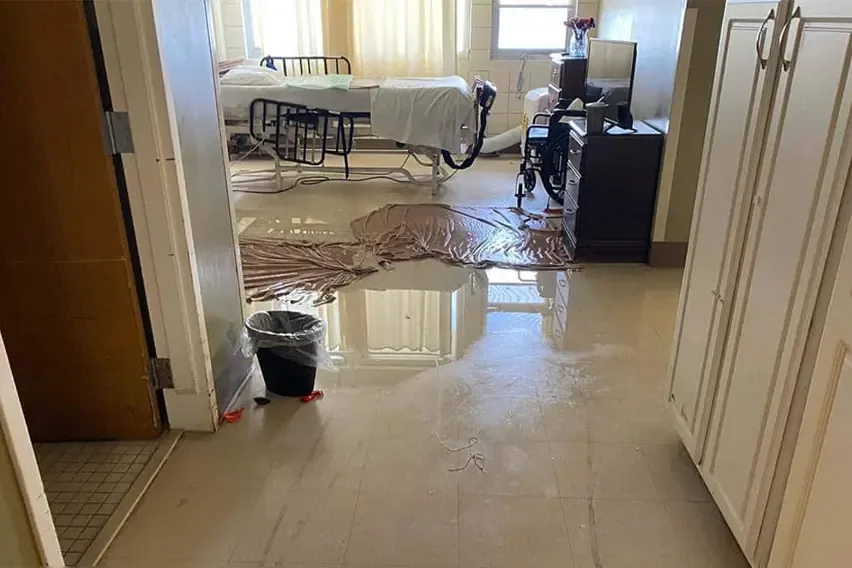 Flood water and mud left across a floor after a storm